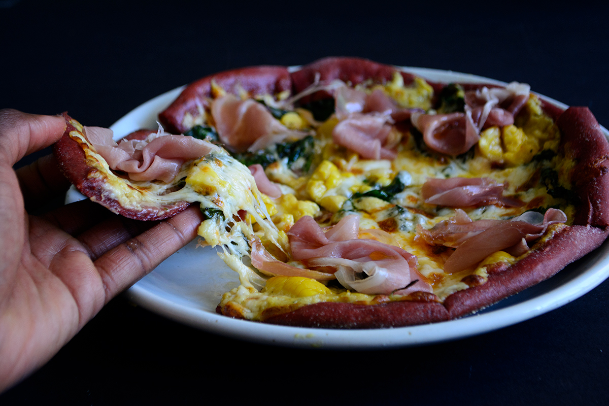 Ackee-Beetza-with-Marinated-Greens,-Mozza-and-Proscuitto
